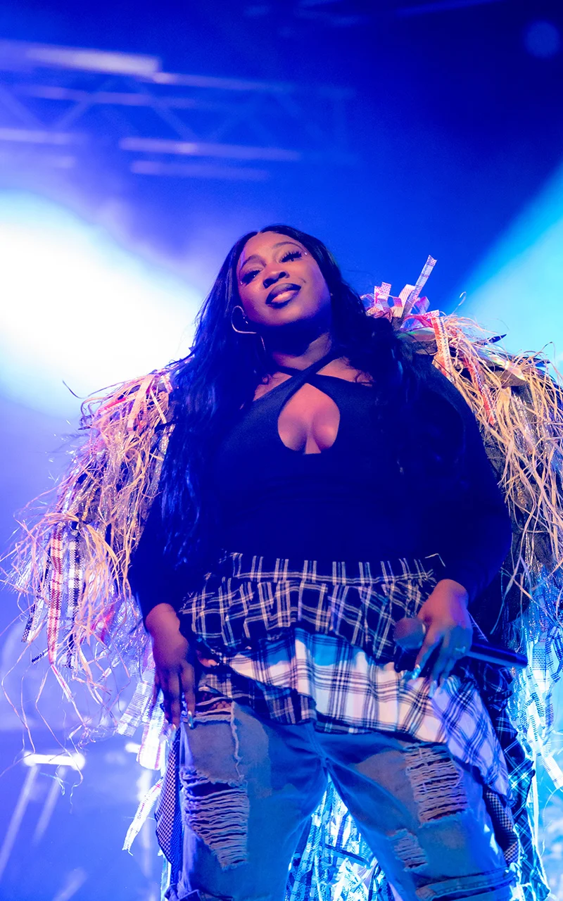 female lead singer pose on stage photograph