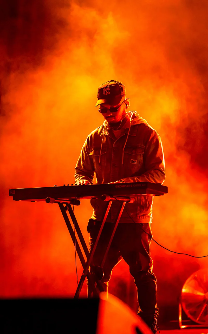 male at keyboard on stage photograph