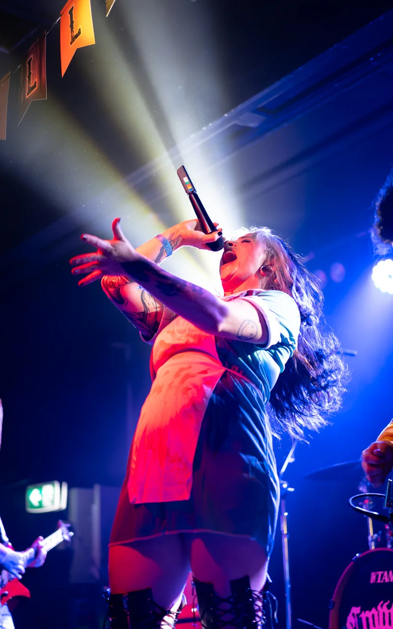 female singer yelling into microphone photograph