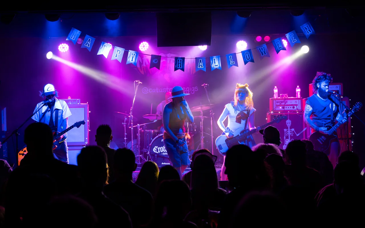 Landwide shot of entire band on stage photograph