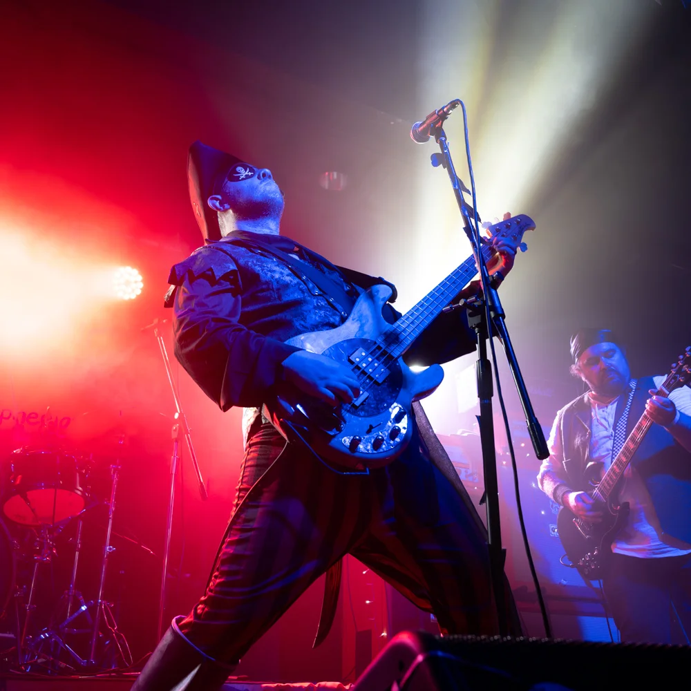 guitar player dressed as pirate striking pose photograph